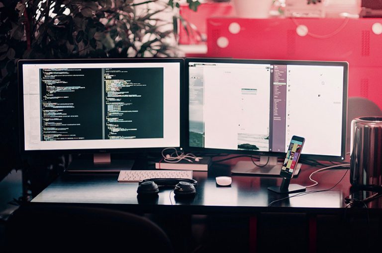 Two computers on a desk